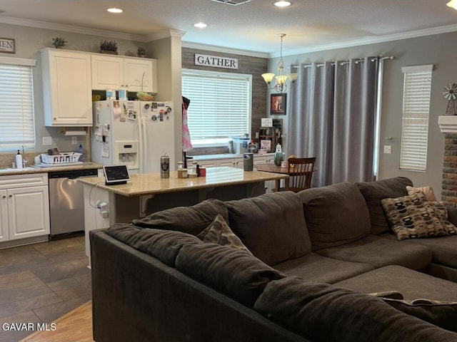 3309 W Brabham Ave, Rosamond, CA 93560 - kitchen featuring white refrigerator with ice dispenser, dishwasher, open floor plan, white cabinetry, and healthy amount of natural light
