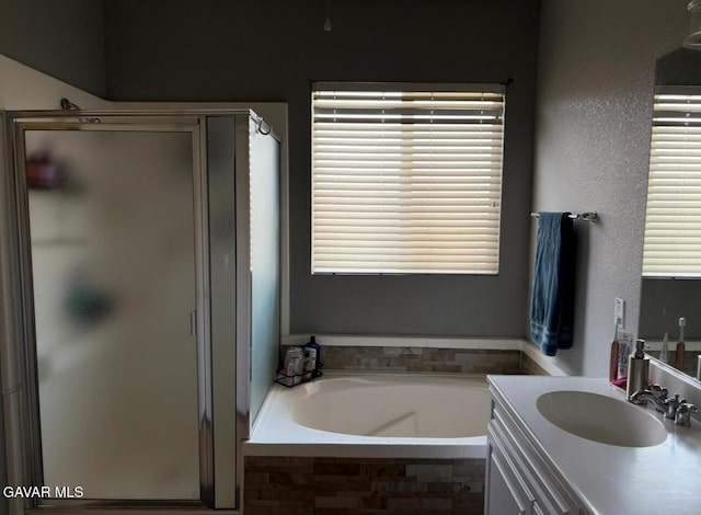 3309 W Brabham Ave, Rosamond, CA 93560 - bathroom with a shower stall, a bath, and vanity