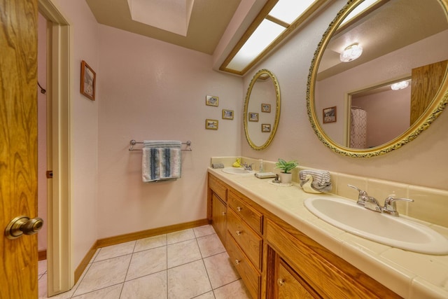 29948 Greenwater Dr, Tehachapi, CA 93561 - full bath featuring double vanity, tile patterned floors, and baseboards