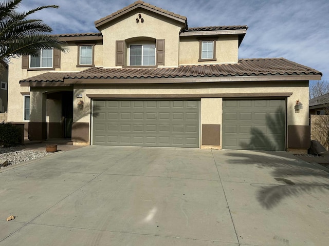 mediterranean / spanish-style house featuring a garage