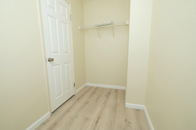 spacious closet with light wood-style flooring