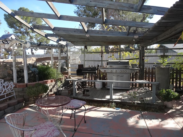 view of patio / terrace with a pergola, a grill, and a wooden deck