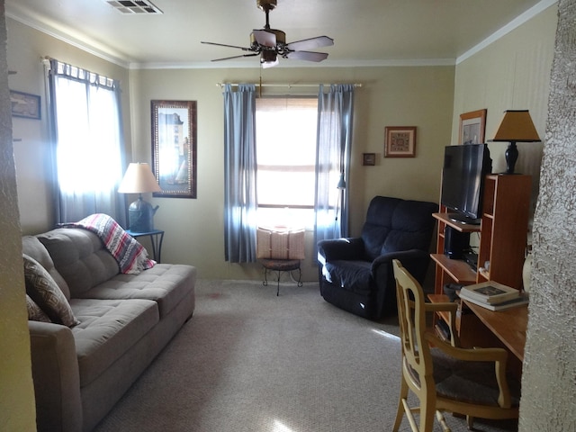 living room with carpet flooring, ceiling fan, and ornamental molding