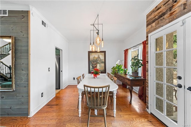 28314 Easton Ln, Saugus, CA 91350 - dining space featuring stairs, wood finished floors, a chandelier, and ornamental molding