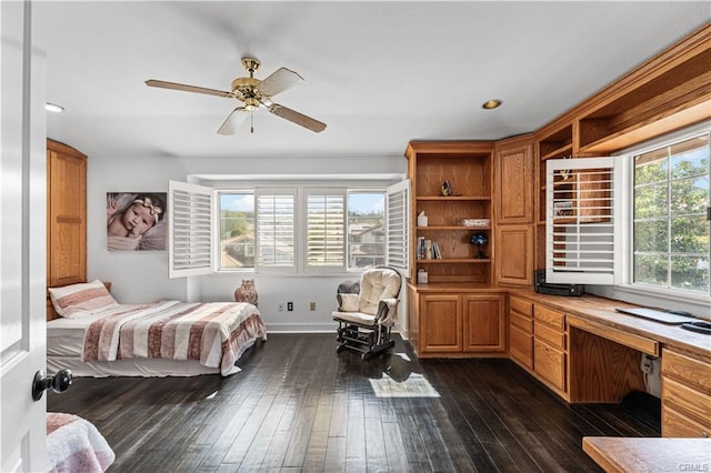 28314 Easton Ln, Saugus, CA 91350 - bedroom featuring dark wood finished floors, built in desk, and a ceiling fan