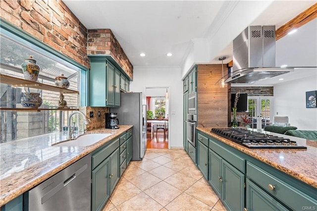 28314 Easton Ln, Saugus, CA 91350 - kitchen featuring stainless steel appliances, island range hood, green cabinets, backsplash, and healthy amount of natural light