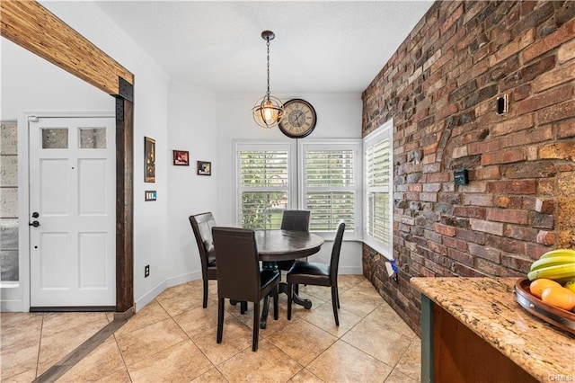 28314 Easton Ln, Saugus, CA 91350 - dining room with brick wall, light tile patterned flooring, crown molding, and a chandelier