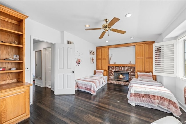 28314 Easton Ln, Saugus, CA 91350 - bedroom with dark wood-type flooring, a brick fireplace, recessed lighting, and ceiling fan