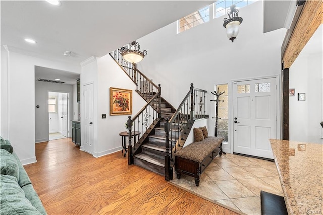 28314 Easton Ln, Saugus, CA 91350 - entrance foyer with stairway, light wood-style flooring, and recessed lighting