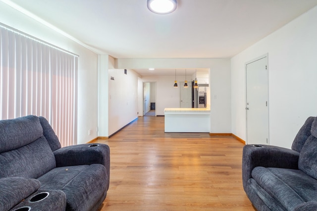 living room with light hardwood / wood-style flooring