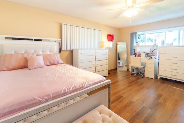 bedroom featuring hardwood / wood-style floors and ceiling fan