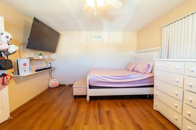 bedroom with wood-type flooring and ceiling fan