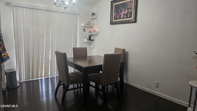 2325 E Pecos Ct, Lancaster, CA 93535 - dining room featuring a chandelier and dark wood-type flooring