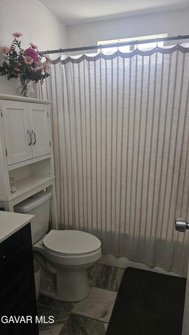 2325 E Pecos Ct, Lancaster, CA 93535 - full bathroom featuring vanity, a shower with curtain, and wood finished floors