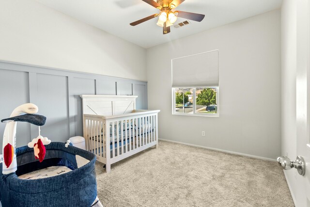 carpeted bedroom with ceiling fan