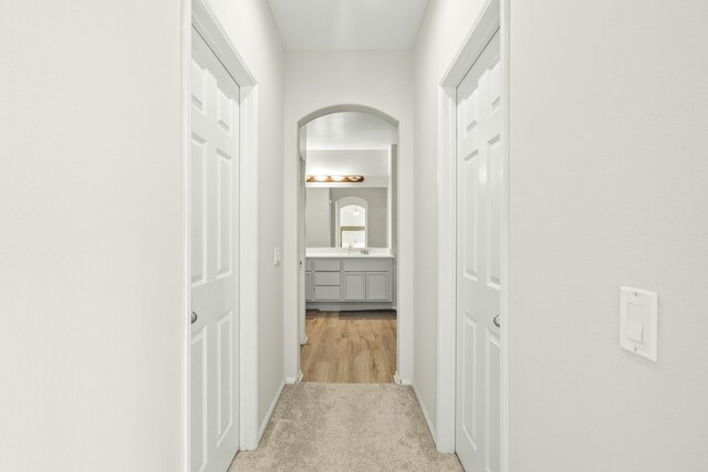 hallway with light carpet