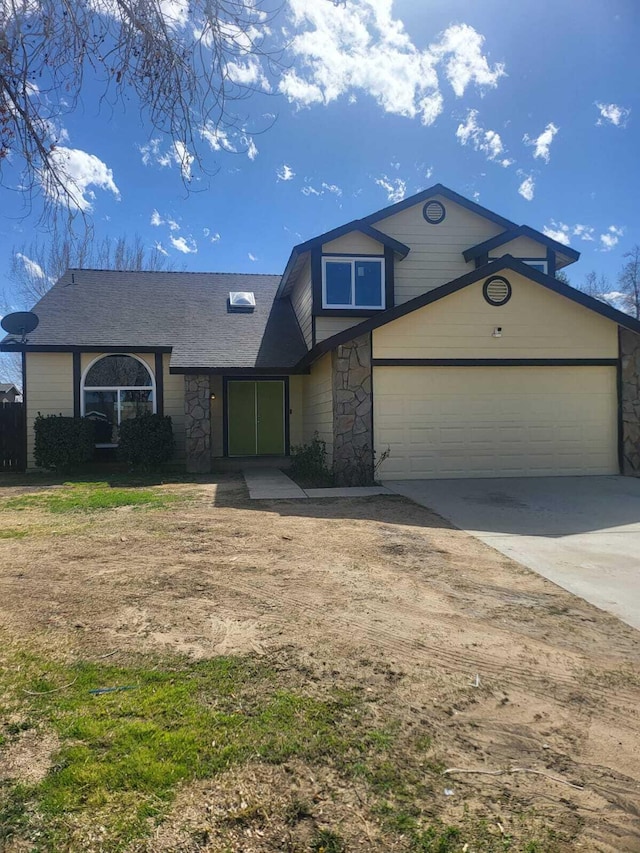 view of front of house featuring driveway and stone siding