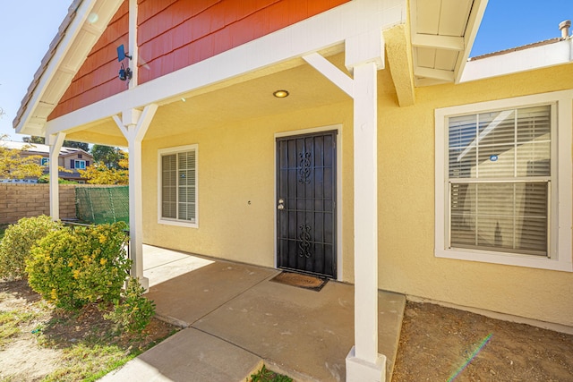 entrance to property with a patio area