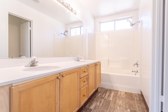 bathroom with vanity, wood-type flooring, and shower / bath combination