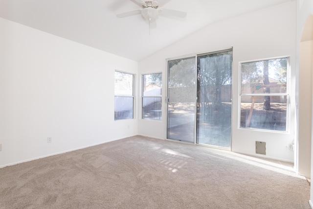 unfurnished room featuring ceiling fan, carpet flooring, and vaulted ceiling