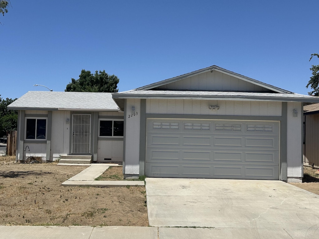 ranch-style home featuring a garage