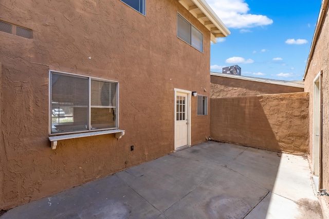 2823 W W Ave Unit J4, Lancaster, CA 93536 - view of side of home featuring a patio area and stucco siding