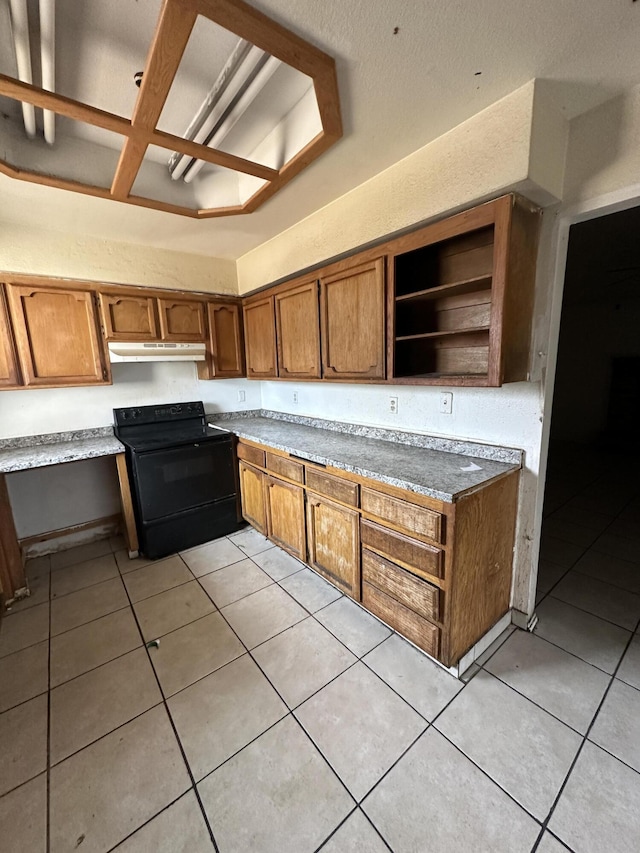 kitchen with light tile patterned floors, under cabinet range hood, black range with electric stovetop, brown cabinets, and open shelves