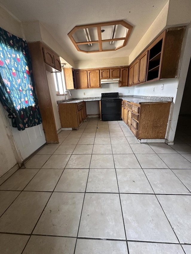 kitchen with brown cabinetry, light tile patterned floors, open shelves, and black range with electric stovetop