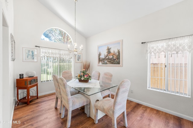 3167 Hampton Rd, Palmdale, CA 93551 - dining area with wood finished floors, a chandelier, and high vaulted ceiling