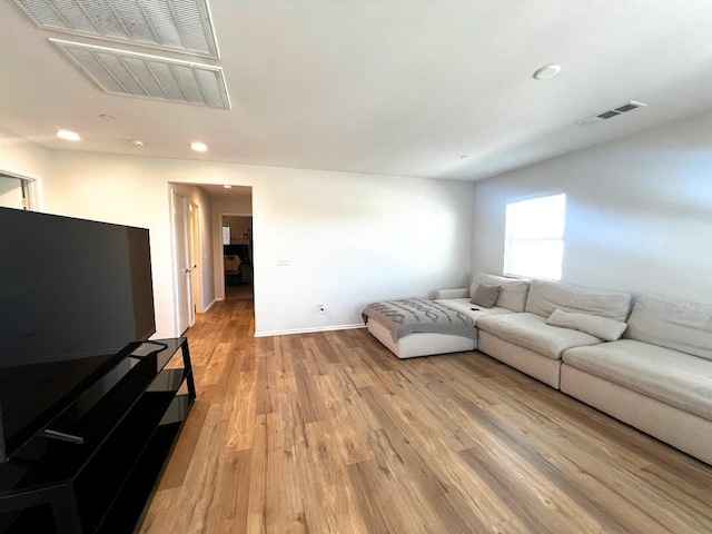 living room with light hardwood / wood-style floors