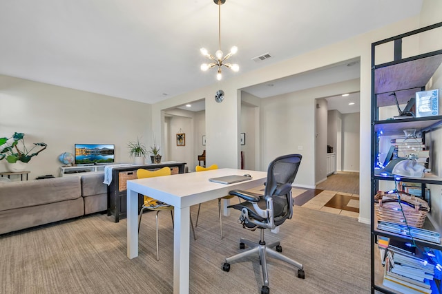 home office with a notable chandelier, baseboards, and visible vents