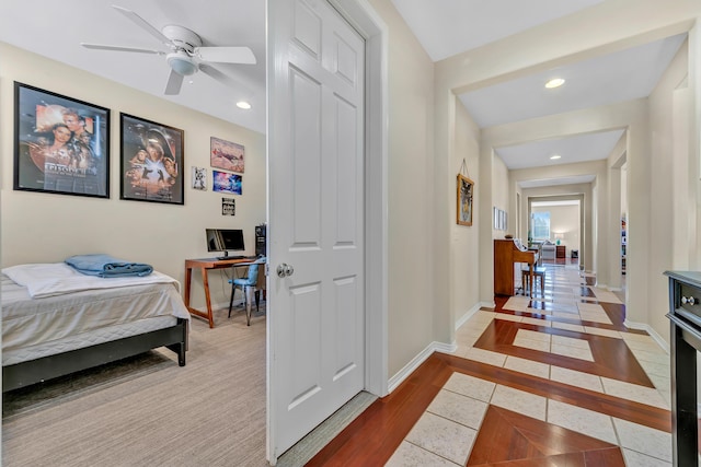 tiled bedroom featuring baseboards and recessed lighting