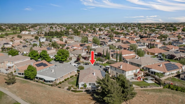 birds eye view of property with a residential view