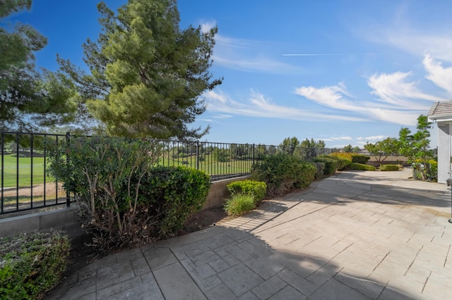 view of patio / terrace featuring fence