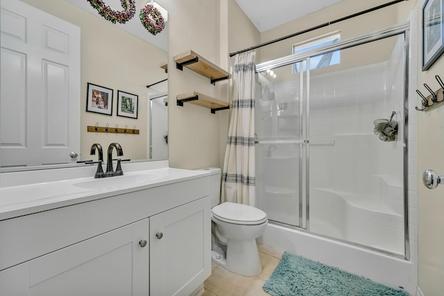 bathroom featuring tile patterned flooring, toilet, a shower with shower curtain, and vanity