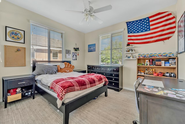 bedroom with carpet, baseboards, and a ceiling fan