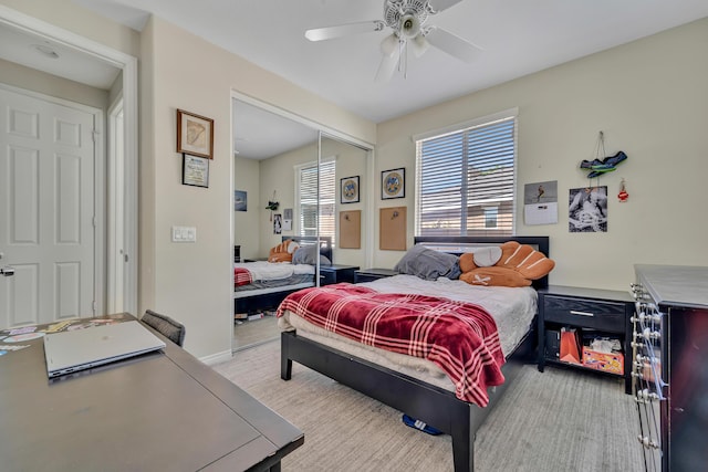 bedroom featuring ceiling fan and a closet
