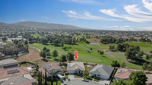 birds eye view of property with a water and mountain view, golf course view, and a residential view