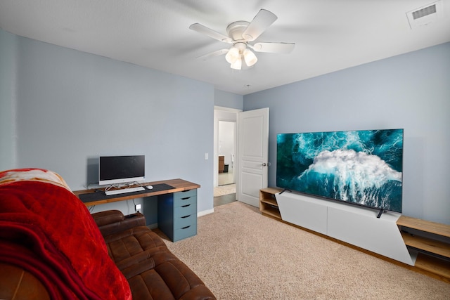 office space with visible vents, ceiling fan, baseboards, and carpet