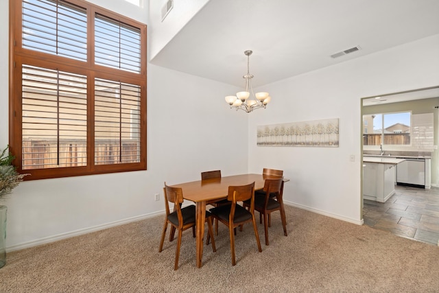 dining room featuring carpet, visible vents, and baseboards