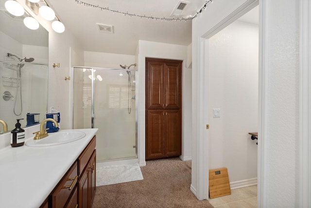 full bathroom with visible vents, a stall shower, and vanity