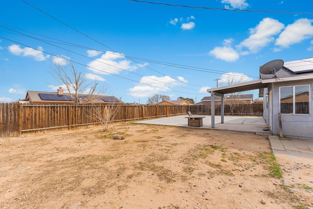 view of yard featuring a patio area and a fenced backyard