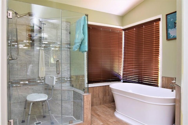 bathroom with separate shower and tub