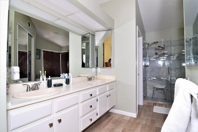 bathroom featuring vanity and an enclosed shower