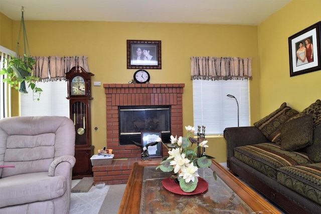 living room featuring a wealth of natural light and a fireplace