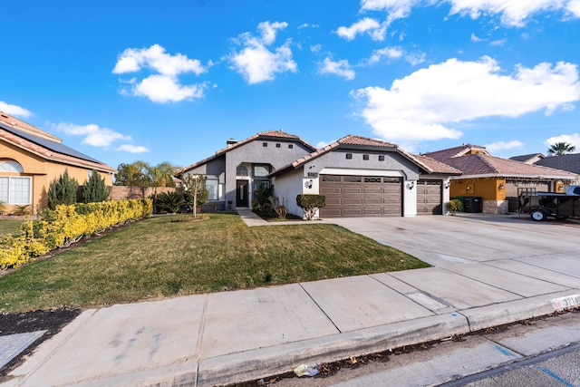 view of front of house featuring a garage and a front yard