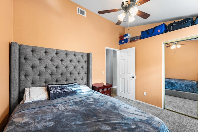 carpeted bedroom with ceiling fan and a closet