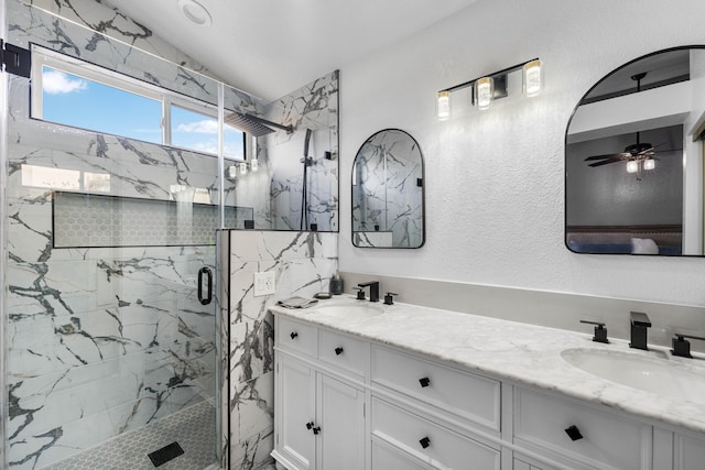 bathroom featuring vanity, vaulted ceiling, and a shower with door