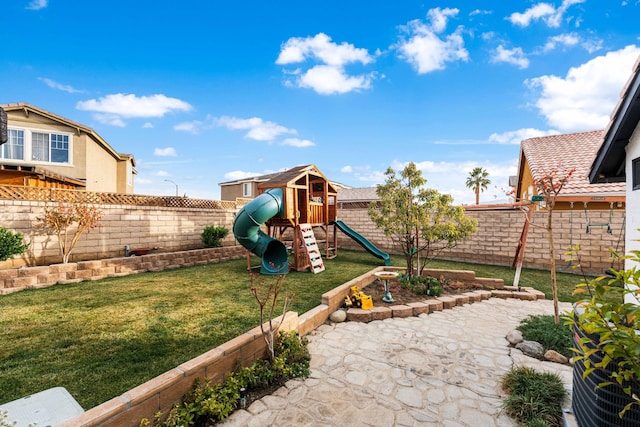 view of jungle gym with a lawn and a patio