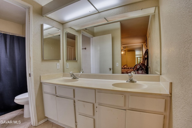 37214 Bunker Ct, Palmdale, CA 93550 - full bath with a textured wall, double vanity, and tile patterned floors